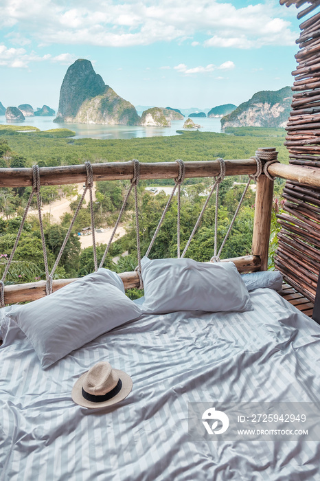 hat against Phang Nga bay background, Tourists relaxing in tropical resort at Samet Nang She, near P