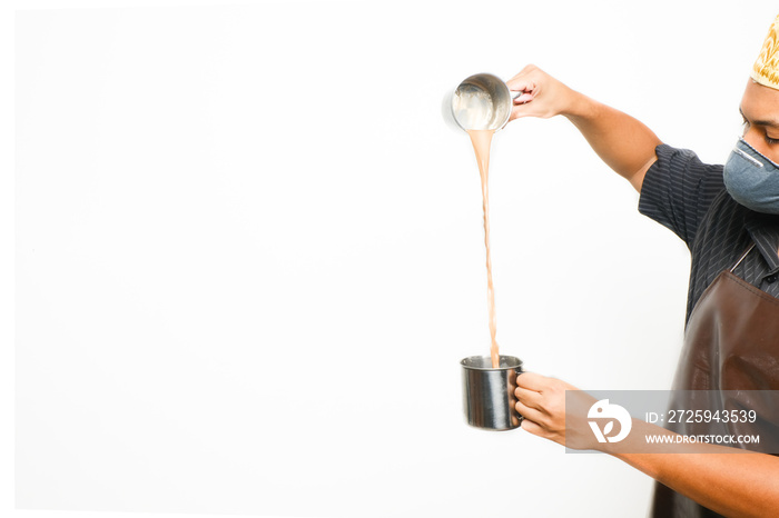 A picture of men preparing famous Malaysia drink call  teh tarik  on copyspace white background. Swe