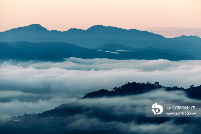 Fog rising between mountains in the evening, Borneo