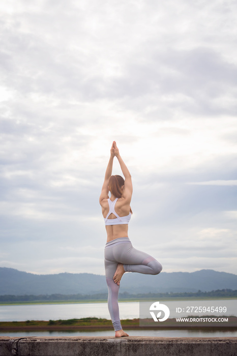 Asia woman doing yoga fitness exercise