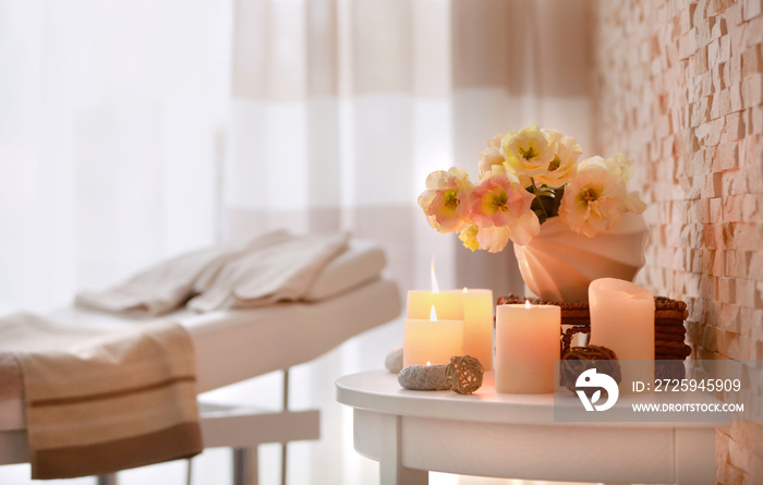 Candles and flowers for relaxation in wellness center