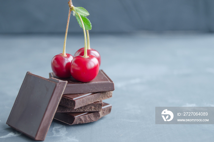 Broken slices of chocolate and cherries