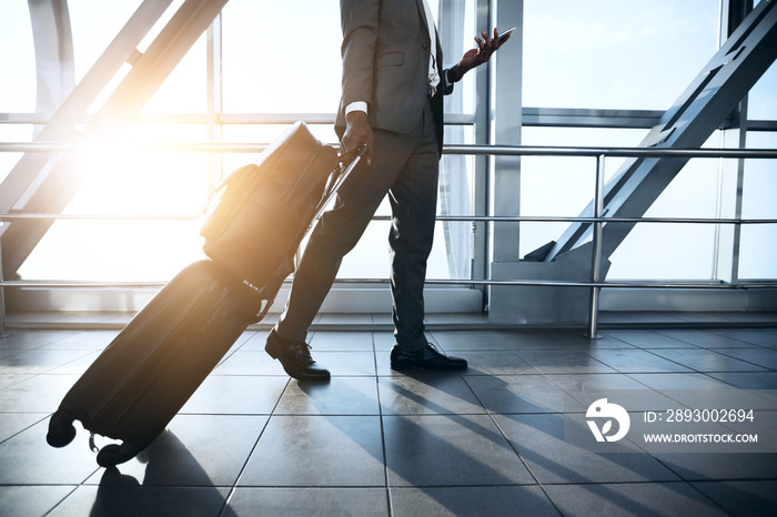 Businessman Carrying Baggage, Moving to Boarding Gate