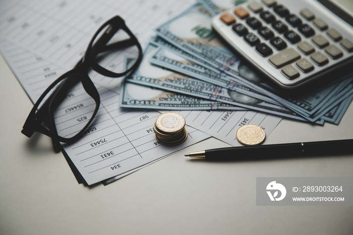 calculator and money on table