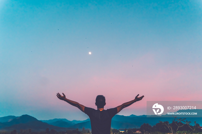 Man rise hands up to sky freedom concept with blue sky.