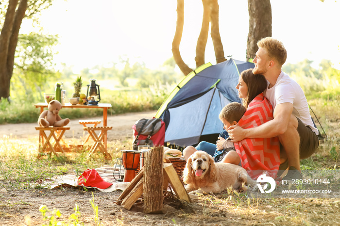 Happy family spending weekend in forest