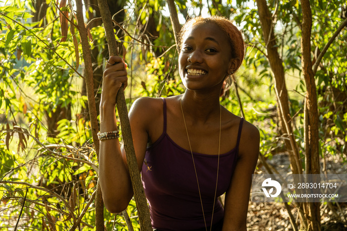 young woman in nature laughing