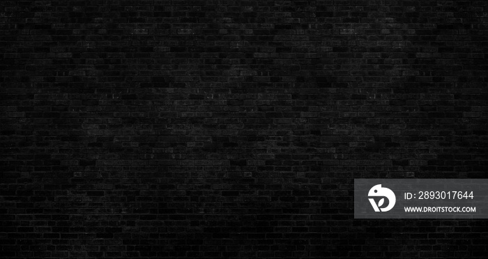 The dark black brick wall has a rough surface as a background image.