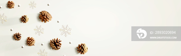 Christmas pine cones with snow flakes - flat lay