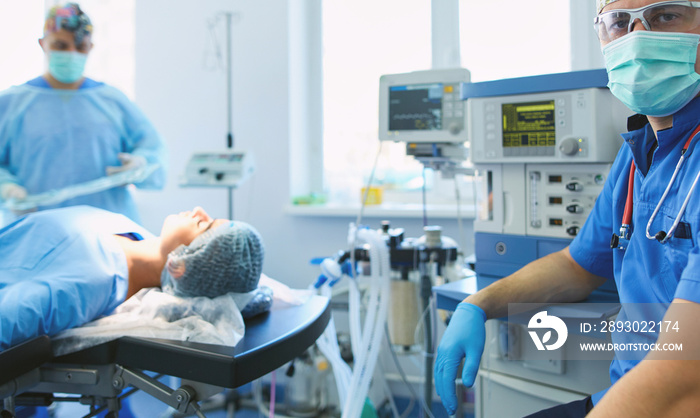 Male surgeon on background in operation room