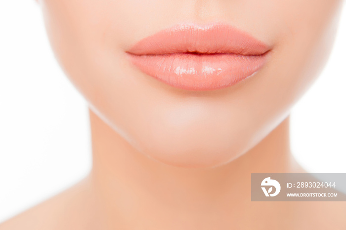 Close up photo of full womans lips after augmentation