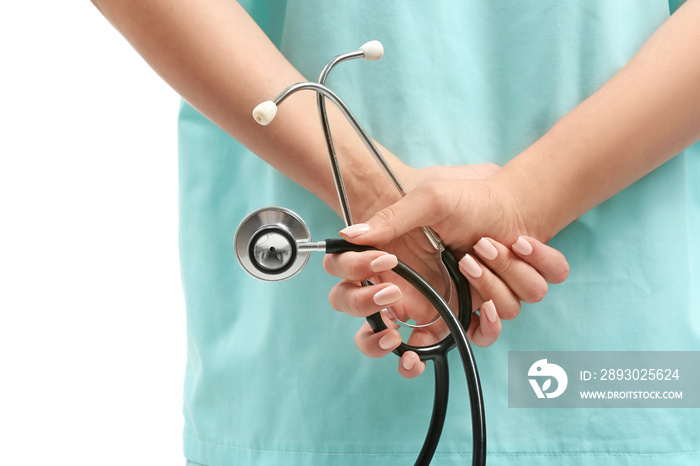 Female nurse with stethoscope on white background, closeup