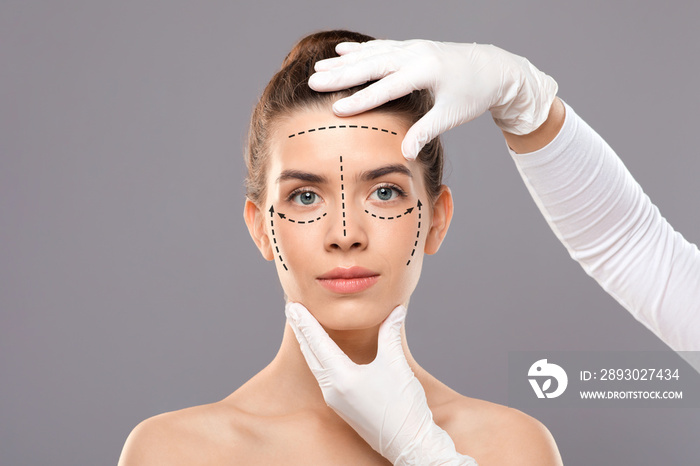 Young woman with face marks getting treatment at beauty clinic