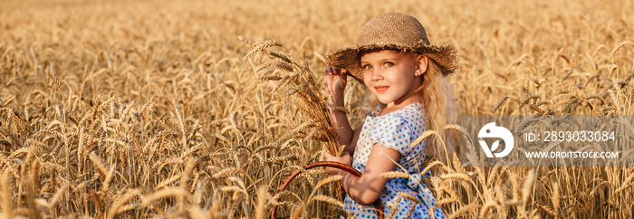 Happy child in autumn wheat field