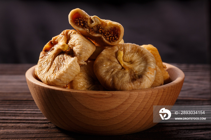 Dried figs on a dark rustic background