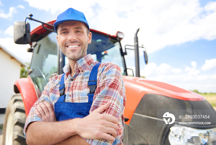 Farmer leaning on the tractor