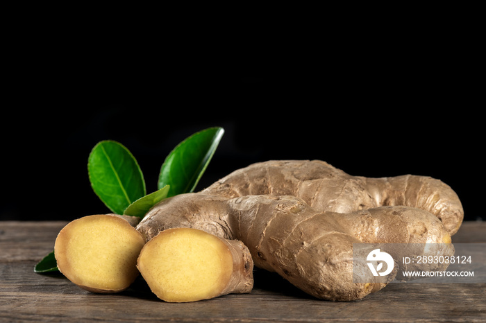 Fresh ginger on wooden background