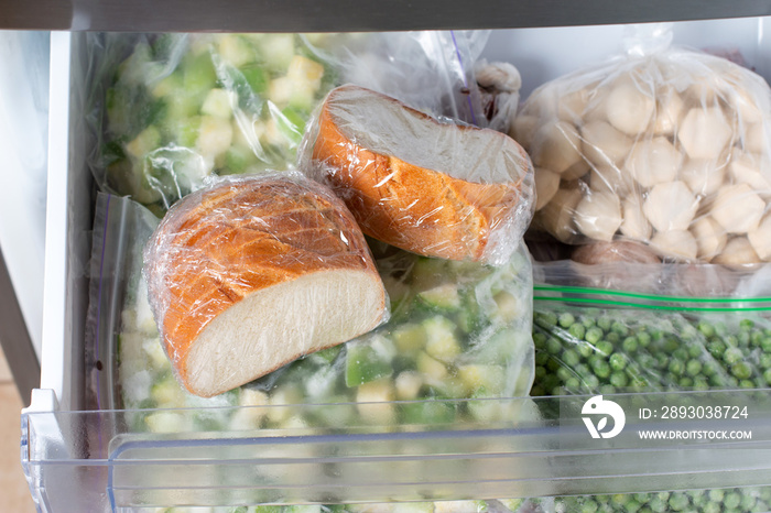 Frozen bread in the home freezer. Long life food storage concept.