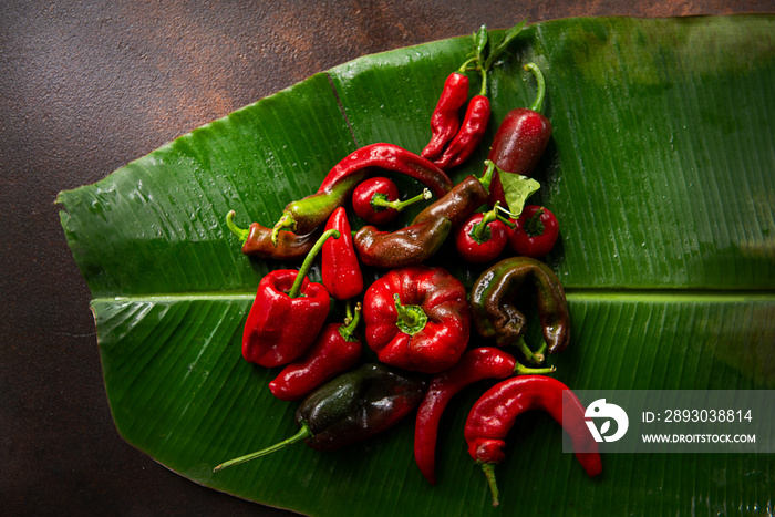 Red chili peppers on a banana leaf