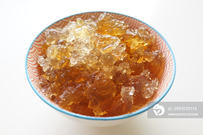 A bowl of soaked Peach Gum. Peach gum is a resin secreted from the bark of the Rosaceae plant peach 