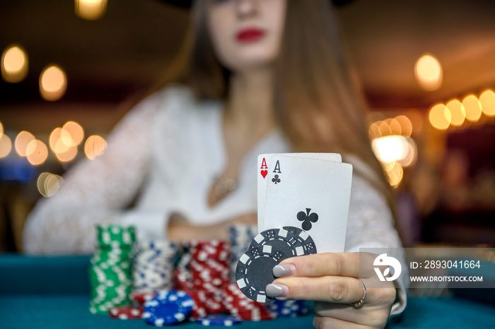 Selective focus on aces combination in female hand