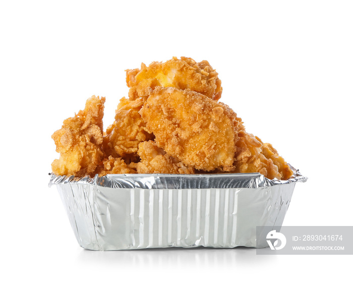 Foil container with tasty popcorn chicken on white background