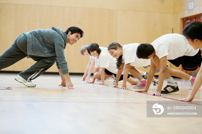 Teacher demonstrating sprinting position