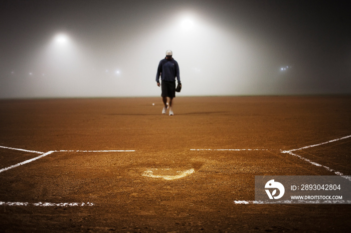 Man standing in baseball field