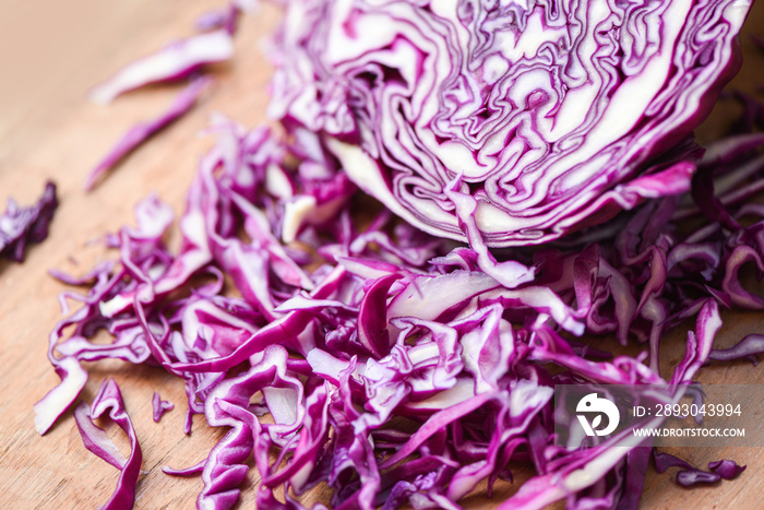 Cabbage purple - Shredded red cabbage slice in a wooden cutting board