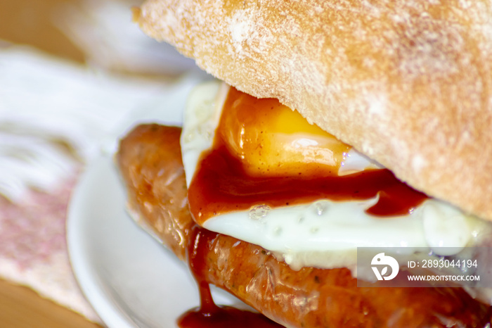 Sausage and Egg Butty with Brown Sauce, a British staple.