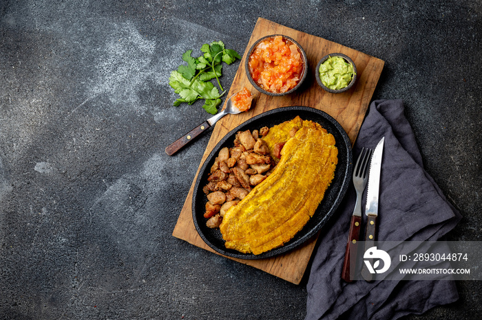 COLOMBIAN CARIBBEAN CENTRAL AMERICAN FOOD. Patacon or toston, fried and flattened whole green planta