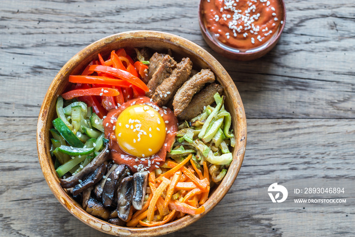 Bowl of bibimbap on the wooden table