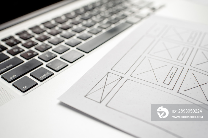 UX website designer drawing wireframe sketch of prototype, framework, layout future project. Creativ