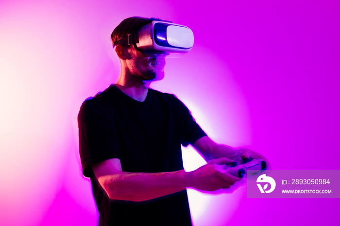 Man using VR virtual reality glasses. Futuristic metaverse universe games and future in digital tech