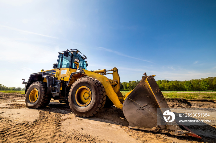 Big wheel loader on a construction site