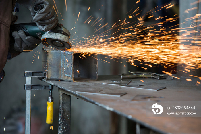 Grinding of materials in metallurgy workshop