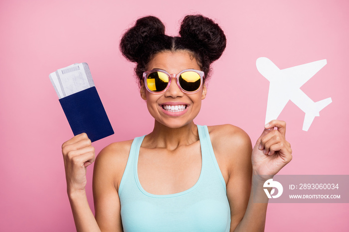 Photo of funny pretty dark skin lady hold paper plane tickets passport airport registration check-in