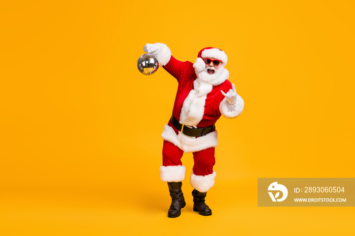 Full body photo crazy santa claus with grey beard hold disco ball show horns symbol dance x-mas chri