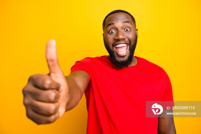 Photo of excited rejoicing overjoyed man delighted with something her has received while isolated wi