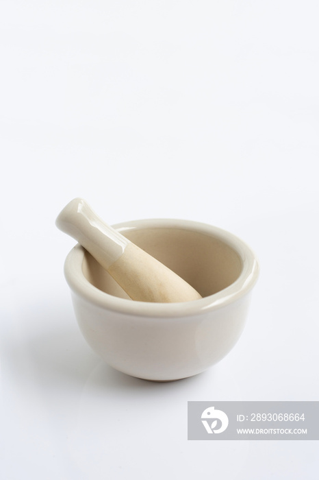 Mortar and pestle on white