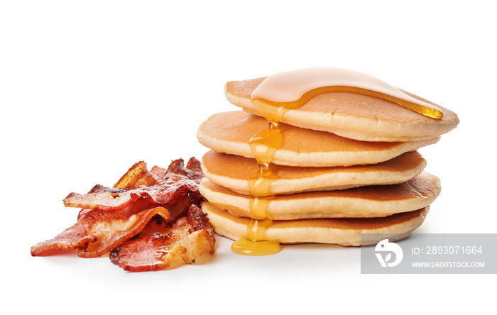 Tasty pancakes with fried bacon on white background