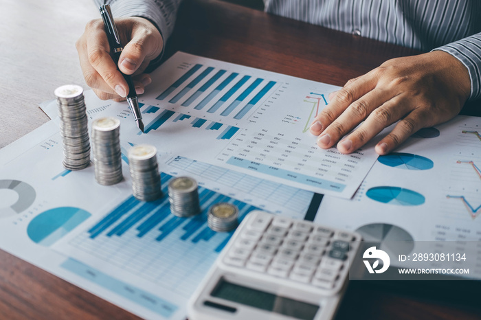 Businessman accountant counting money and making notes at report doing finances and calculate about 