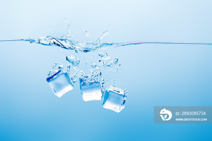 transparent pure water with splash and ice on blue background