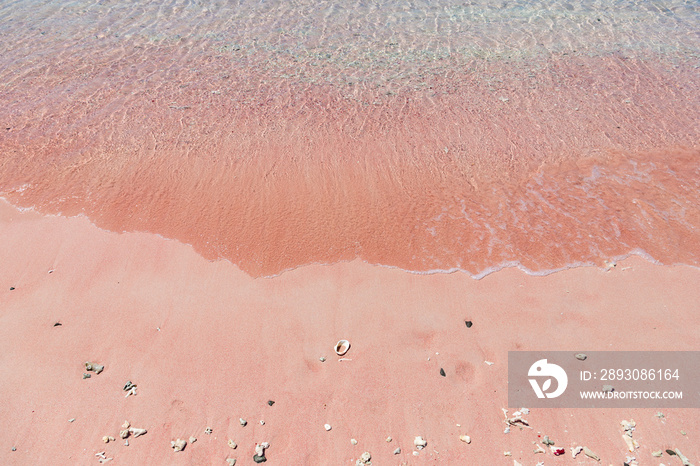 Long pink beach on Padar island with turquoise water. Deserted beach with pink sand. Komodo National