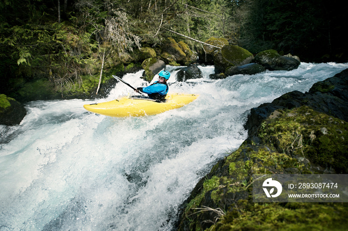 Young man canoeing