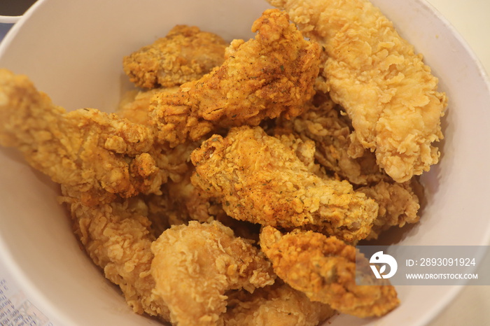 Tasty, delicious golden yellow fried chicken bucket. KFC chicken bucket.