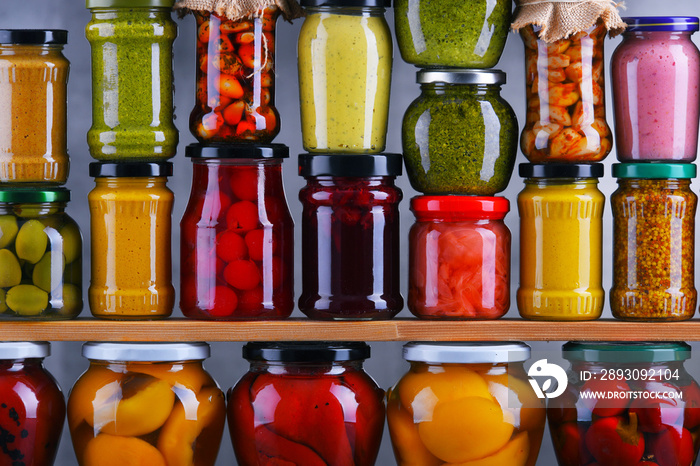 Jars with variety of pickled vegetables and fruits