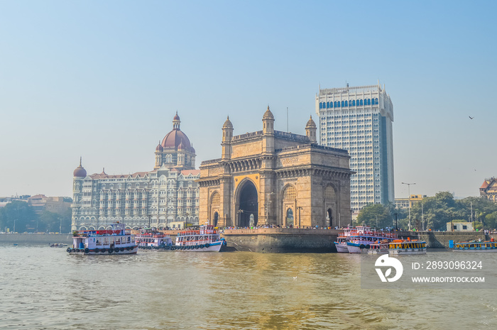 Beautiful Gateway of India near Taj Palace hotel on the Mumbai harbour with many jetties on Arabian 