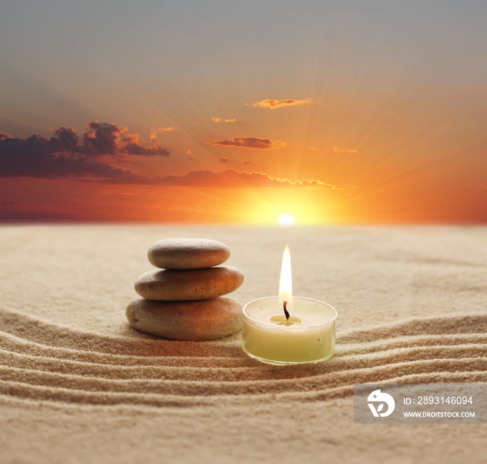 stack of stones and candle light