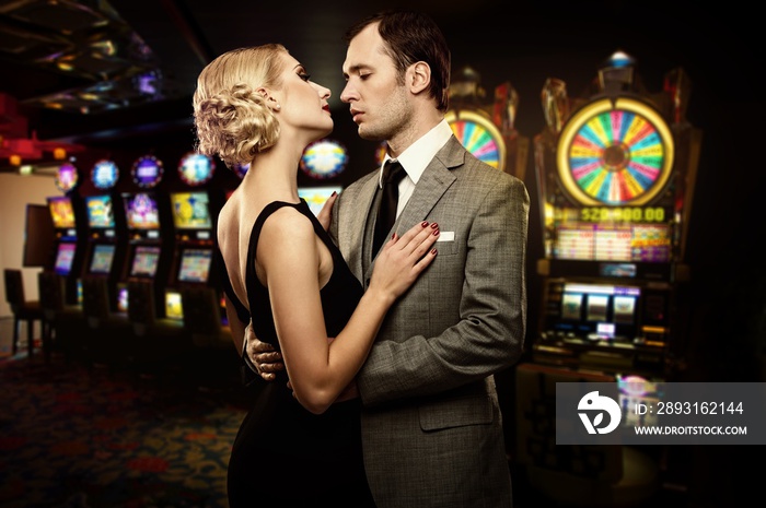 Retro couple against slot machines